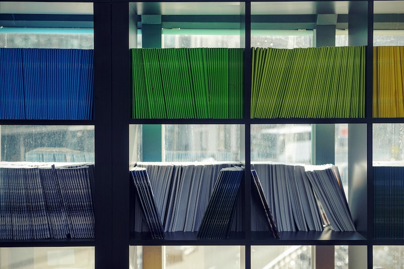 A shelf of neatly stacked folders