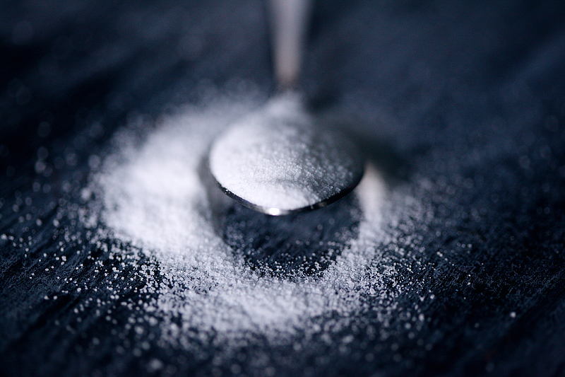 A spoon of white sugar